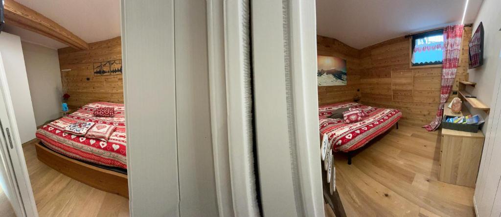 Postel nebo postele na pokoji v ubytování Residenze Vezza - Il Larice -