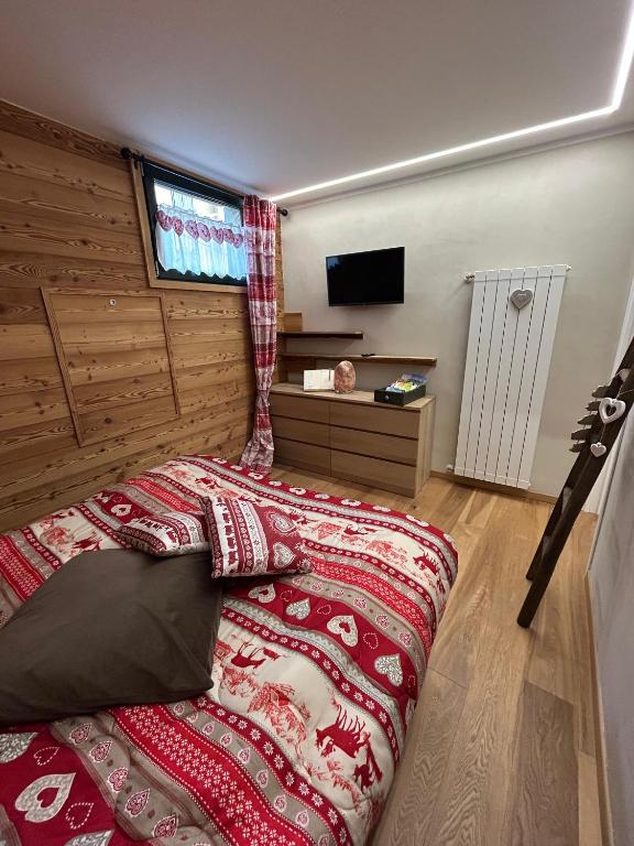 Postel nebo postele na pokoji v ubytování Residenze Vezza - Il Larice -