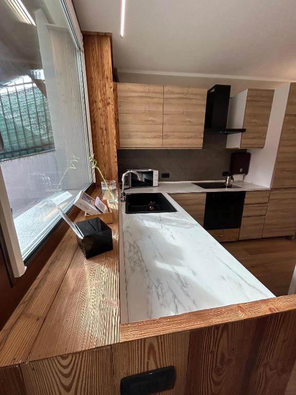 Postel nebo postele na pokoji v ubytování Residenze Vezza - Il Larice -