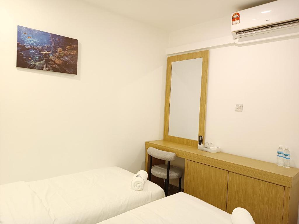 Postel nebo postele na pokoji v ubytování Shoreline Guesthouse 海岸线客栈