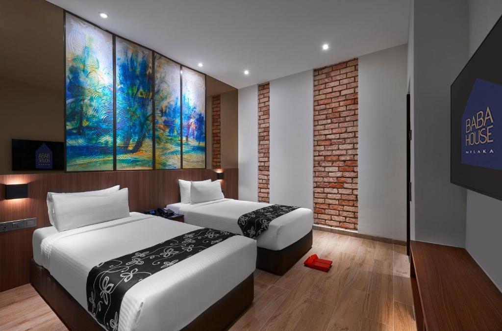 Postel nebo postele na pokoji v ubytování Baba House Melaka