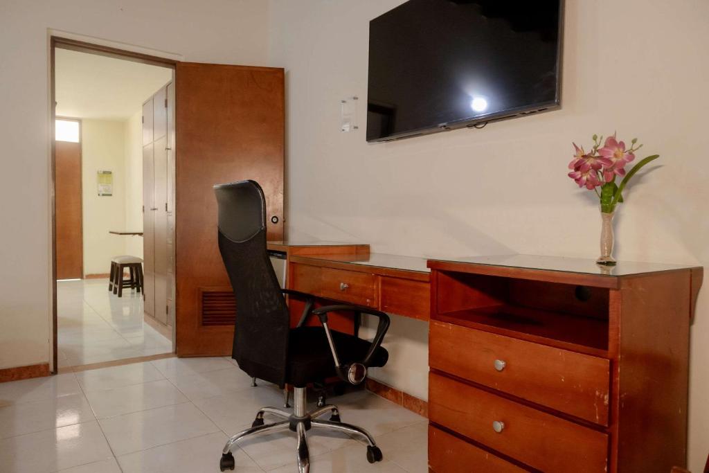 TV a/nebo společenská místnost v ubytování Hotel Faranda Bolivar Cucuta, a member of Radisson Individuals