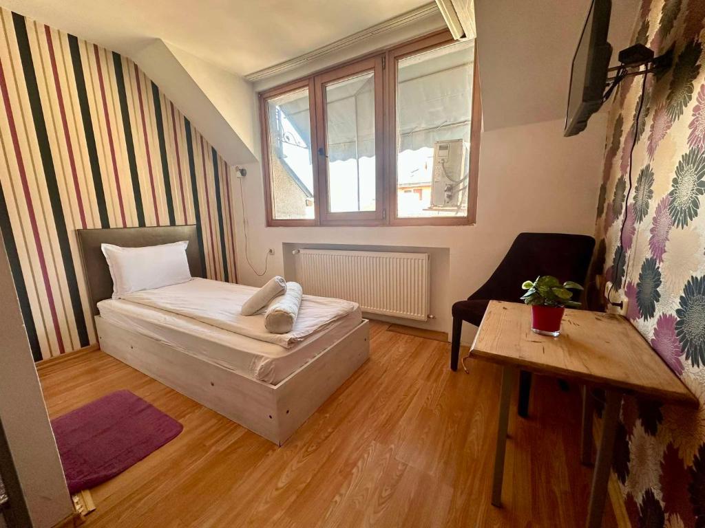 Postel nebo postele na pokoji v ubytování Family Hotel Amor