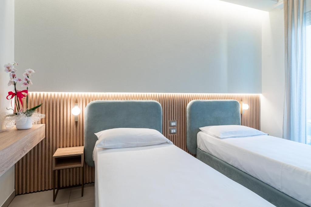 Postel nebo postele na pokoji v ubytování Park Hotel Morigi Garden & Spa