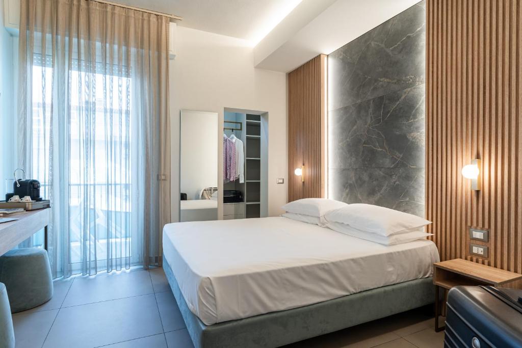 Postel nebo postele na pokoji v ubytování Park Hotel Morigi Garden & Spa