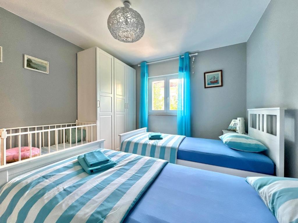 Posteľ alebo postele v izbe v ubytovaní Apartment Didi with private garden, close to the Krk center