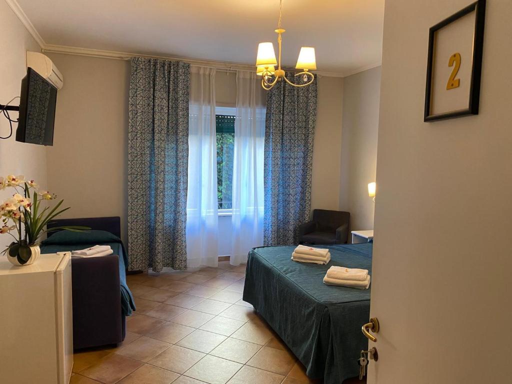 A bed or beds in a room at Domus Prati