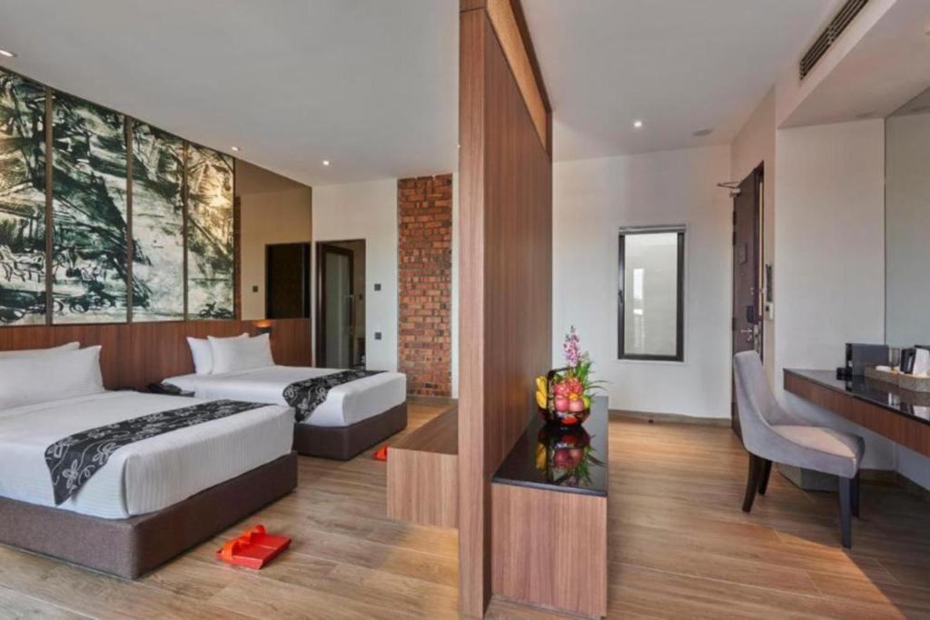 Postel nebo postele na pokoji v ubytování Baba House Melaka