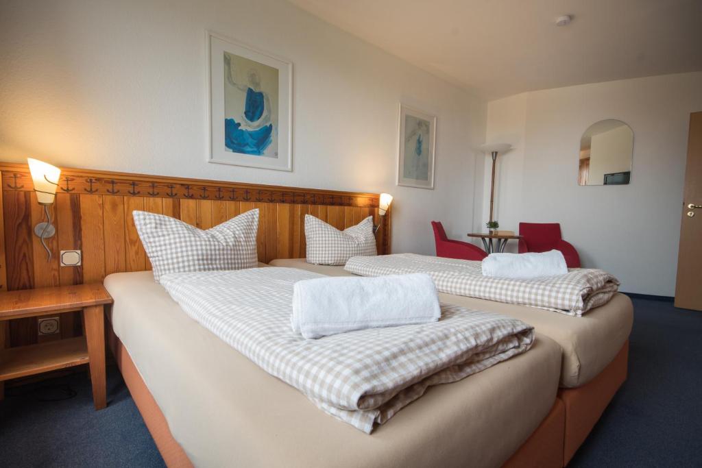 Postel nebo postele na pokoji v ubytování Hotel Nige Hus