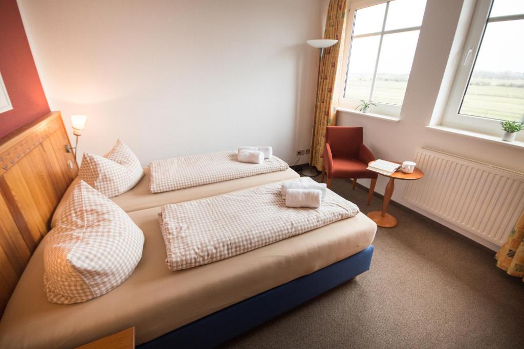 Postel nebo postele na pokoji v ubytování Hotel Nige Hus