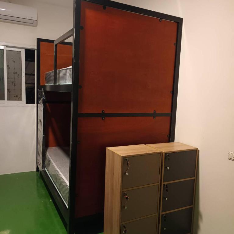 Palanda nebo palandy na pokoji v ubytování Green Gen Hotel, Mueang Phuket