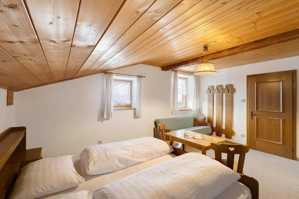 Postel nebo postele na pokoji v ubytování Bartlhof Refugium-Ritiro
