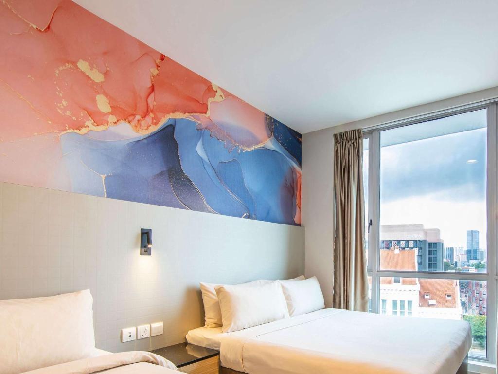 Postel nebo postele na pokoji v ubytování ibis Styles Singapore Albert