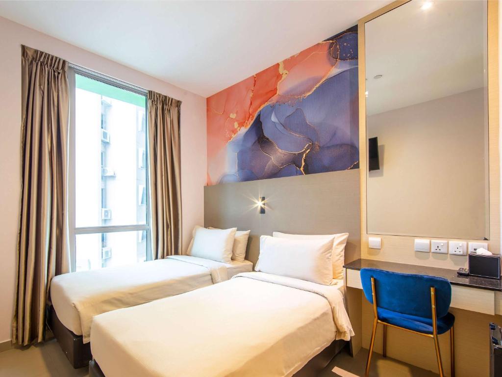 Postel nebo postele na pokoji v ubytování ibis Styles Singapore Albert