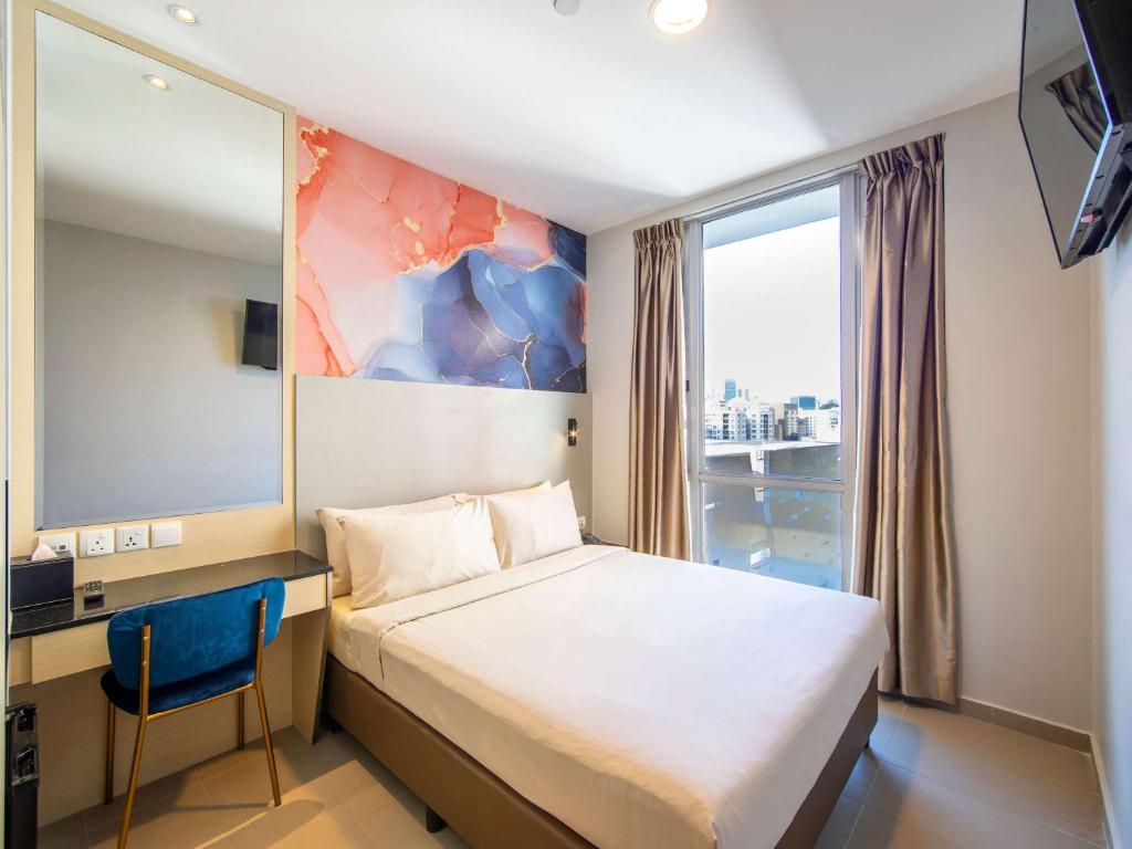 Postel nebo postele na pokoji v ubytování ibis Styles Singapore Albert