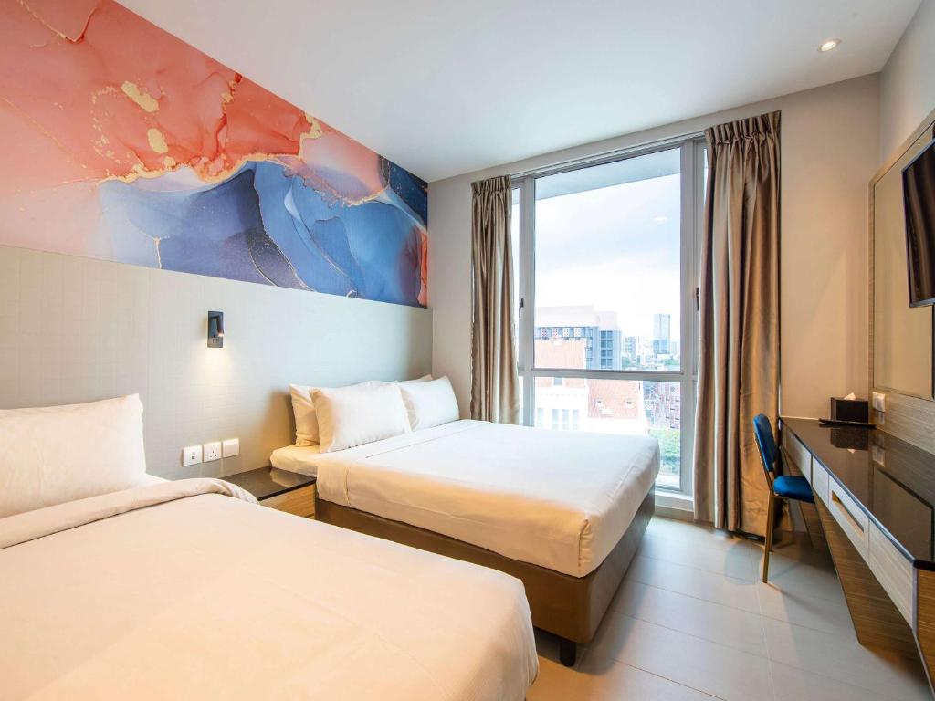 Postel nebo postele na pokoji v ubytování ibis Styles Singapore Albert