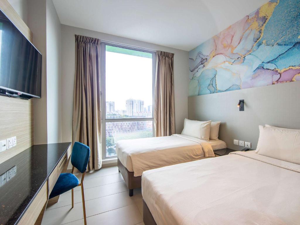 Postel nebo postele na pokoji v ubytování ibis Styles Singapore Albert