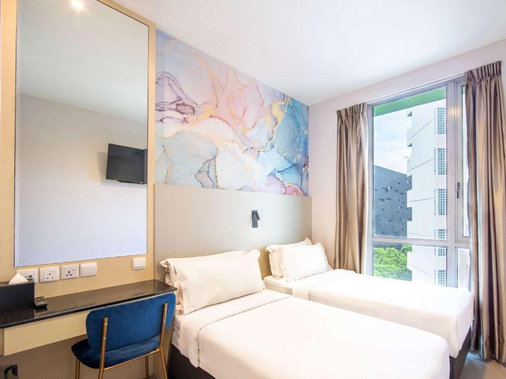 Postel nebo postele na pokoji v ubytování ibis Styles Singapore Albert