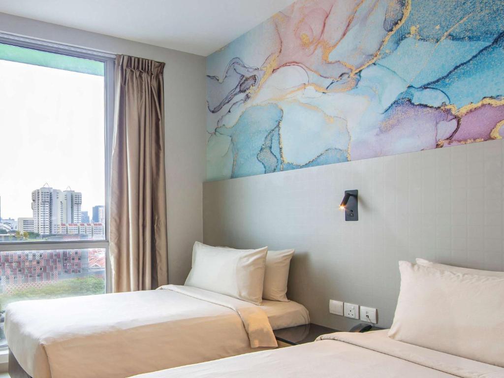 Postel nebo postele na pokoji v ubytování ibis Styles Singapore Albert