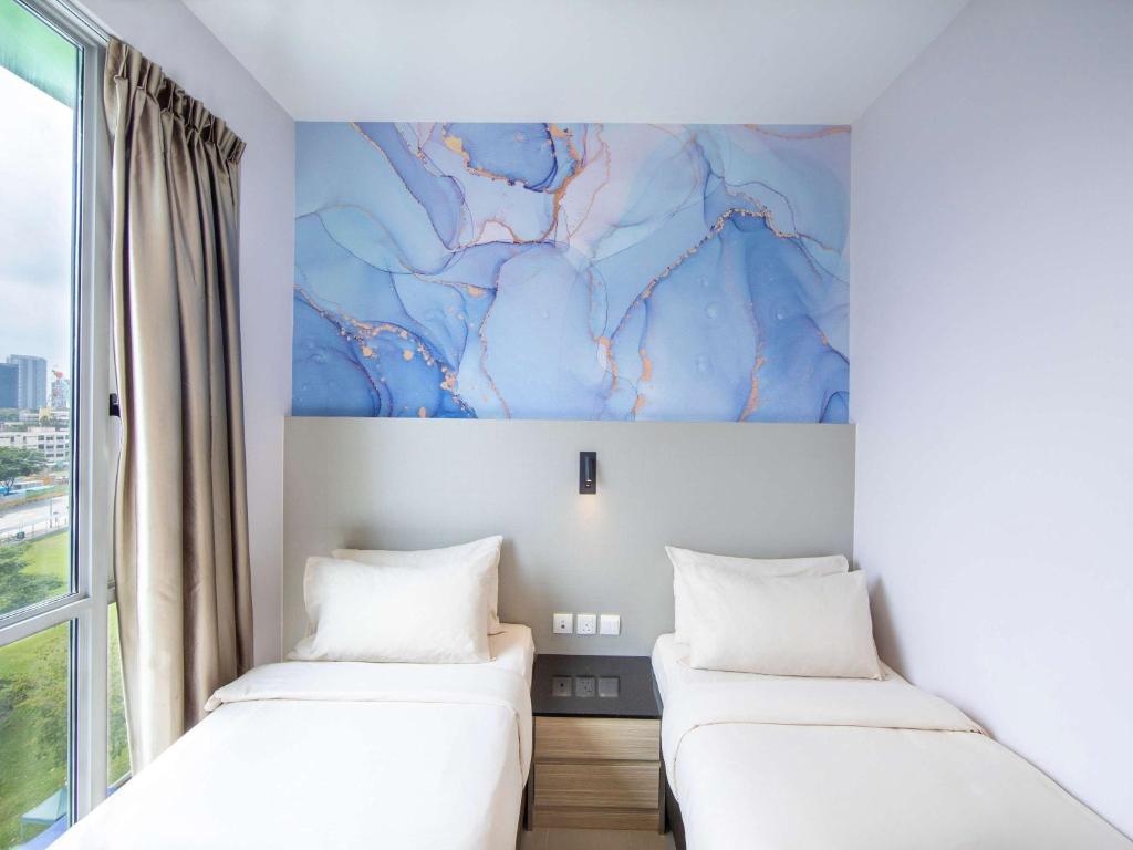 Postel nebo postele na pokoji v ubytování ibis Styles Singapore Albert