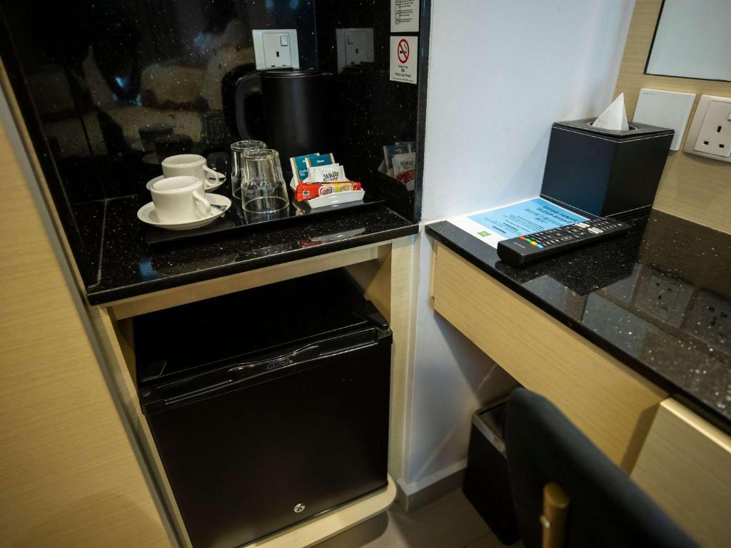 Kuchyň nebo kuchyňský kout v ubytování ibis Styles Singapore Albert