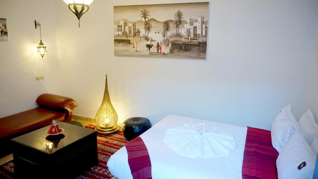 Postel nebo postele na pokoji v ubytování RIAD KALE POLIS