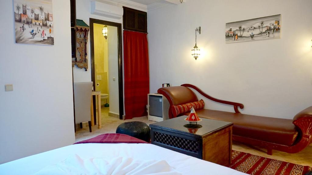 Postel nebo postele na pokoji v ubytování RIAD KALE POLIS