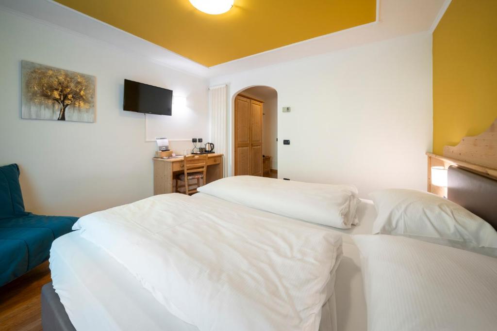 Postel nebo postele na pokoji v ubytování Hotel Erica