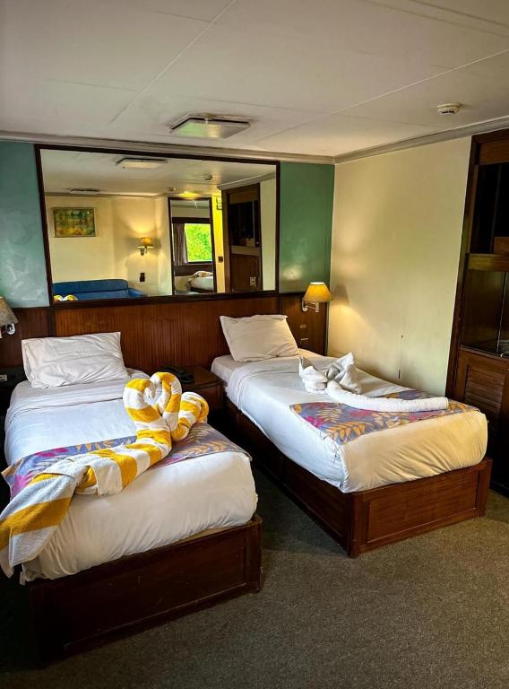 Postel nebo postele na pokoji v ubytování Nile View Aton Cruise
