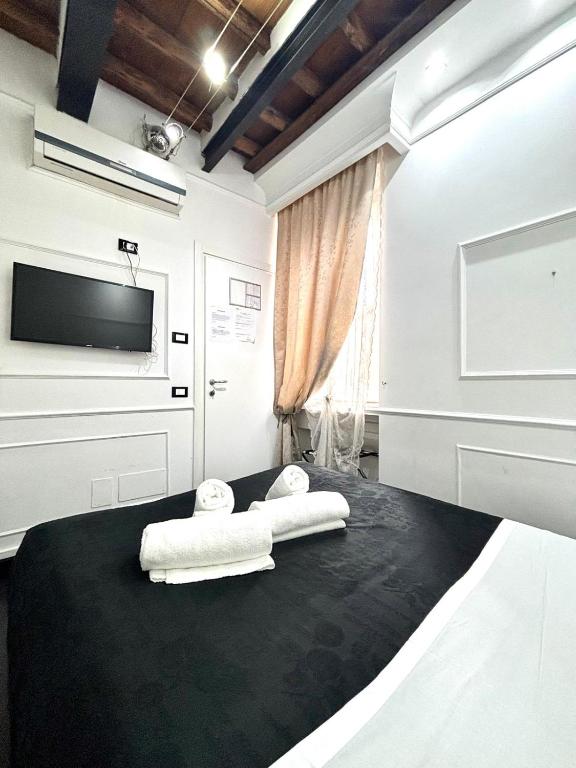 A bed or beds in a room at L'antica Locanda Dell'Orso