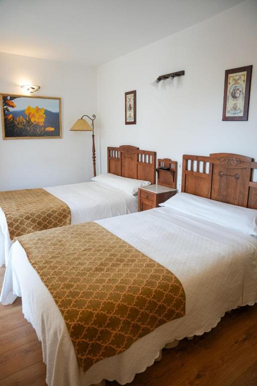 Postel nebo postele na pokoji v ubytování Hotel Rústico Fonteverde