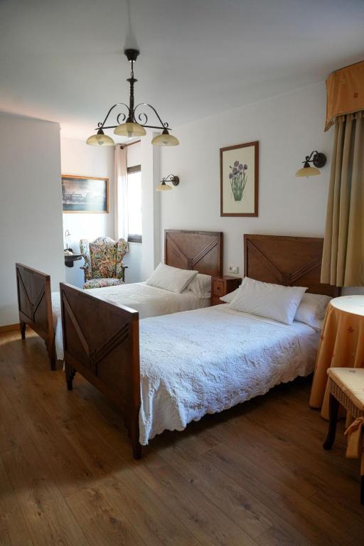 Postel nebo postele na pokoji v ubytování Hotel Rústico Fonteverde