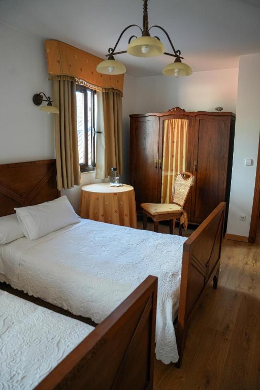 Postel nebo postele na pokoji v ubytování Hotel Rústico Fonteverde