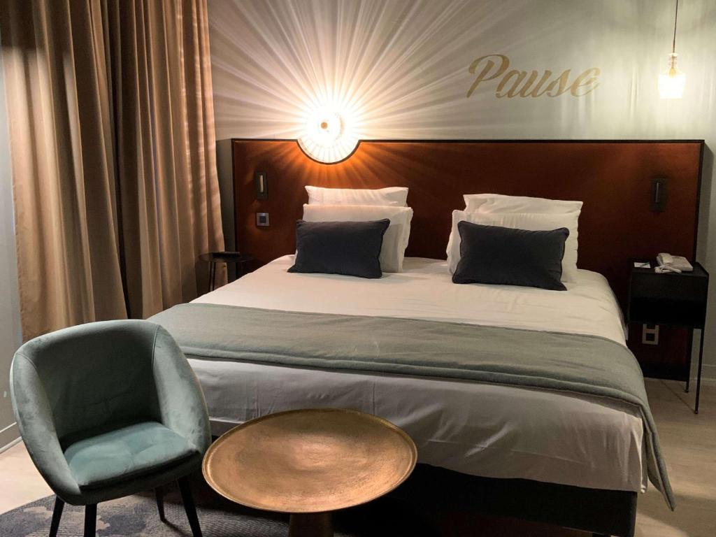 Postel nebo postele na pokoji v ubytování Hôtel Mercure Montauban