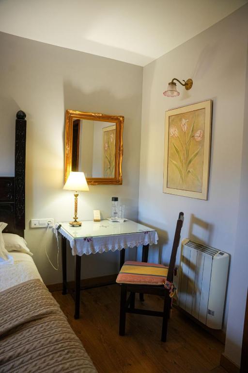 Postel nebo postele na pokoji v ubytování Hotel Rústico Fonteverde