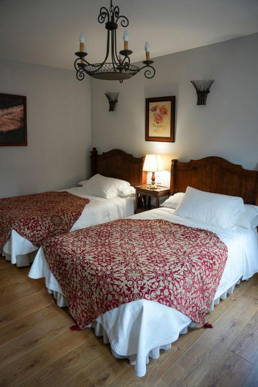 Postel nebo postele na pokoji v ubytování Hotel Rústico Fonteverde
