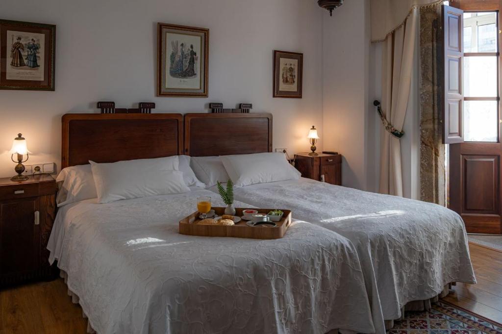 Postel nebo postele na pokoji v ubytování Hotel Rústico Fonteverde