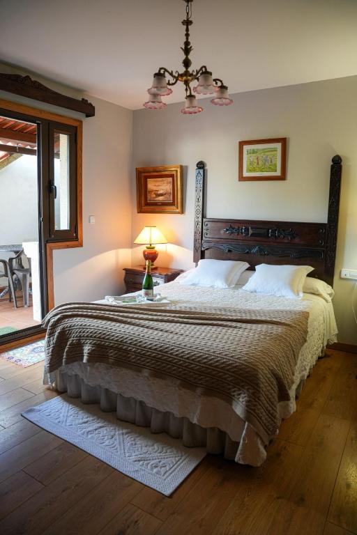 Postel nebo postele na pokoji v ubytování Hotel Rústico Fonteverde