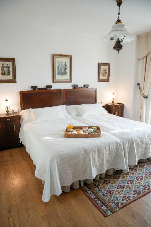 Postel nebo postele na pokoji v ubytování Hotel Rústico Fonteverde