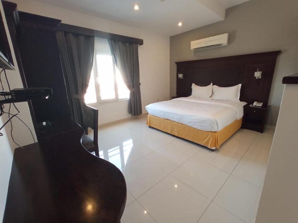 Postel nebo postele na pokoji v ubytování Asfar Hotel Apartments