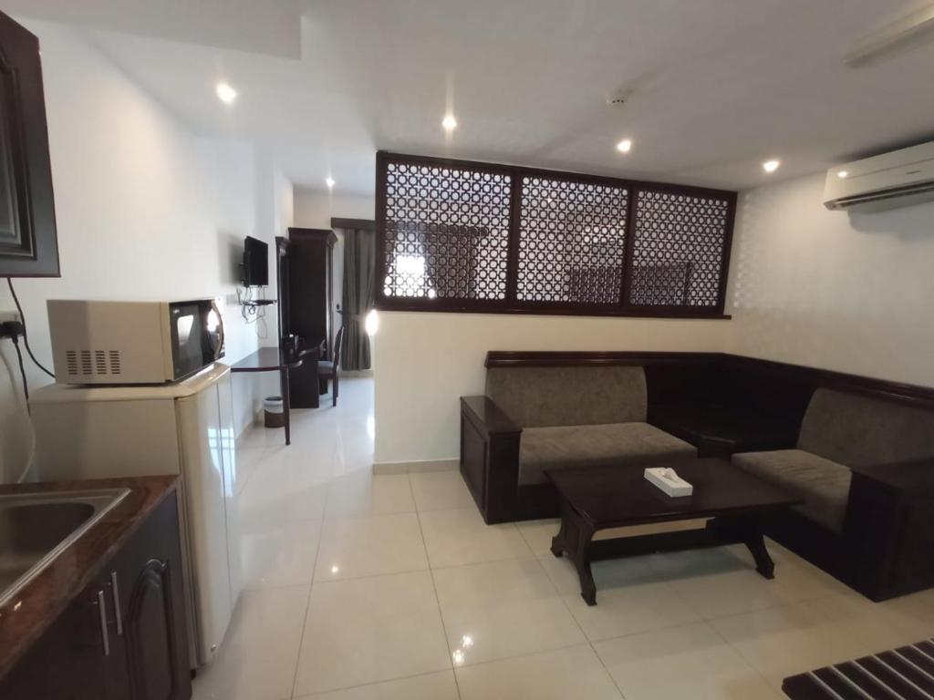Kuchyň nebo kuchyňský kout v ubytování Asfar Hotel Apartments