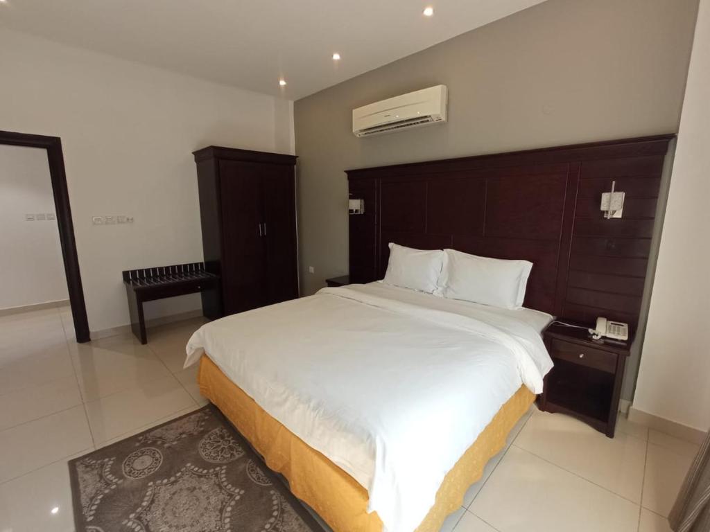 Postel nebo postele na pokoji v ubytování Asfar Hotel Apartments
