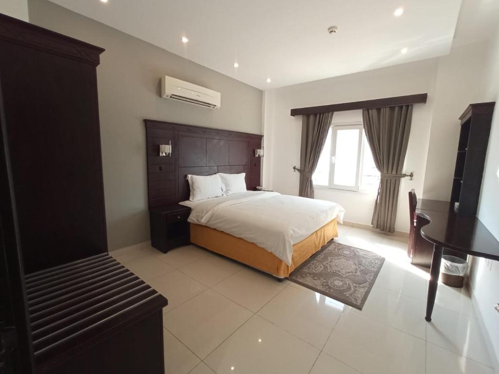Postel nebo postele na pokoji v ubytování Asfar Hotel Apartments