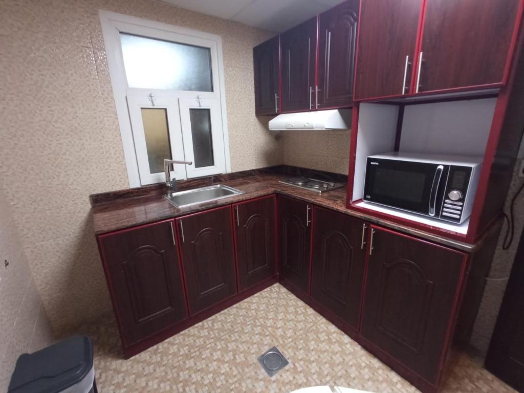 Kuchyň nebo kuchyňský kout v ubytování Asfar Hotel Apartments