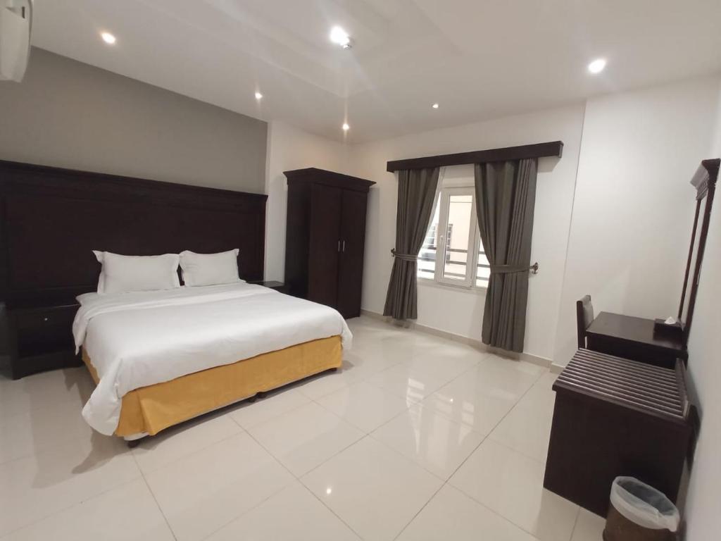 Postel nebo postele na pokoji v ubytování Asfar Hotel Apartments