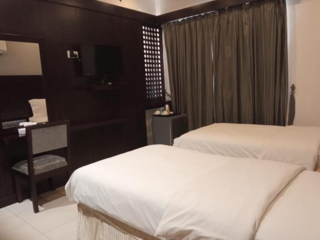 Postel nebo postele na pokoji v ubytování Asfar Hotel Apartments