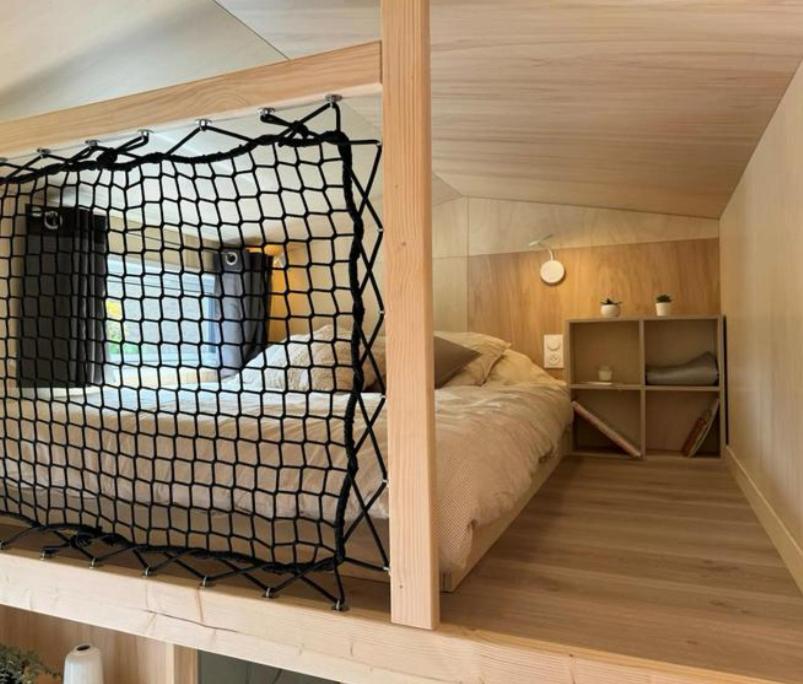 Postel nebo postele na pokoji v ubytování Eco Tiny housse
