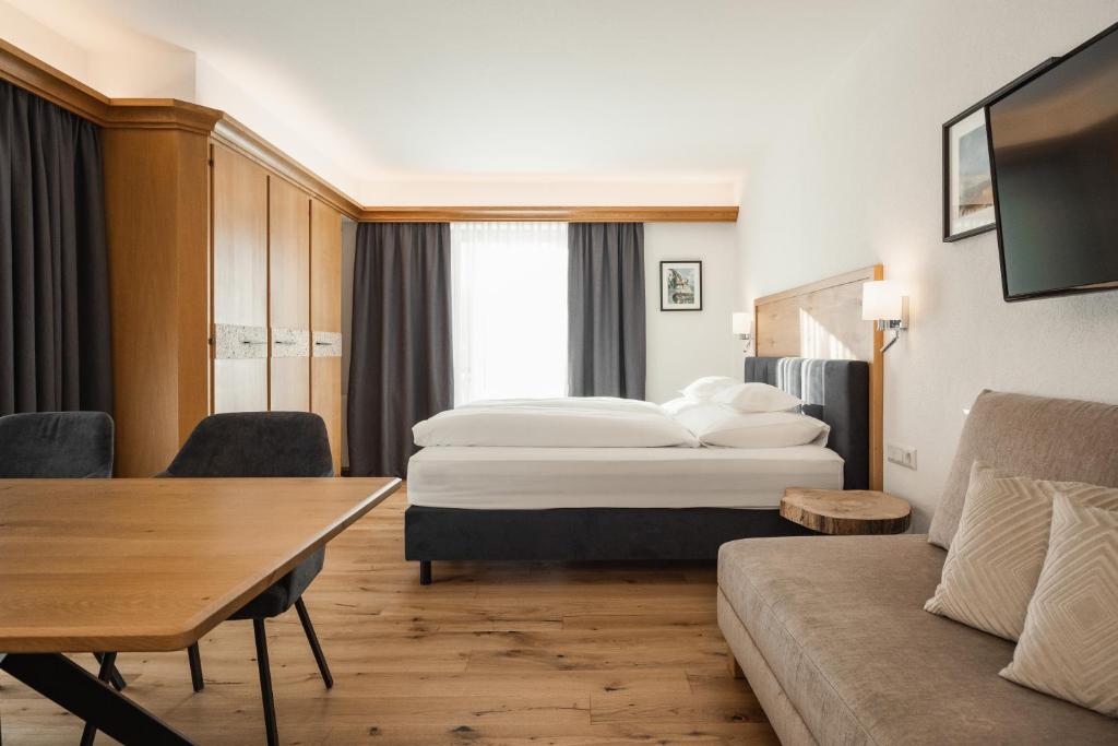 Postel nebo postele na pokoji v ubytování Jochum Hotel Garni