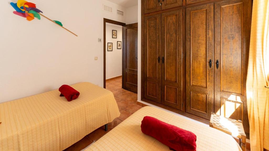 Postel nebo postele na pokoji v ubytování Casa Rocío