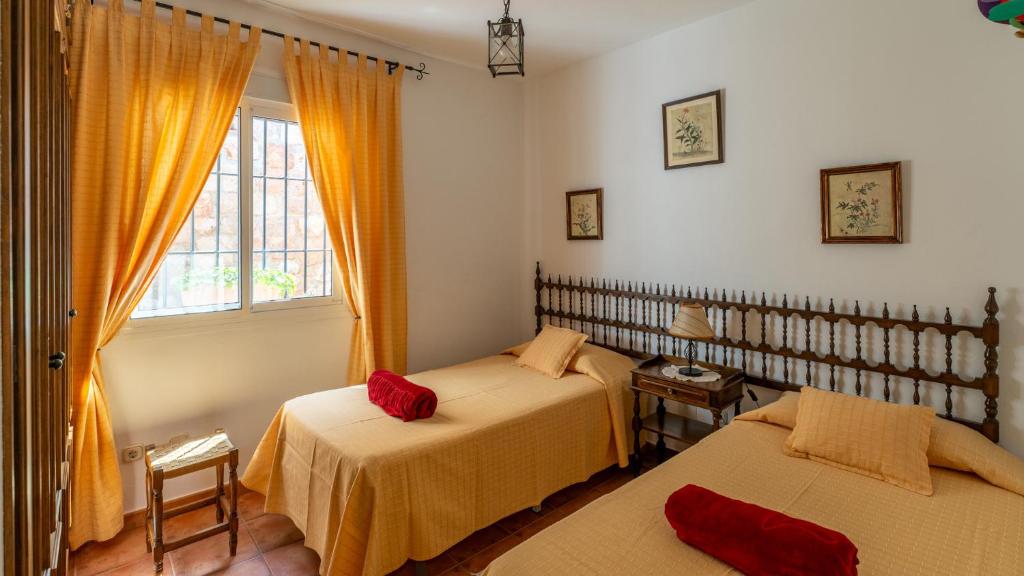 Postel nebo postele na pokoji v ubytování Casa Rocío